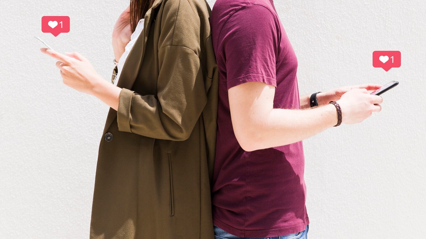 Couple standing back to back